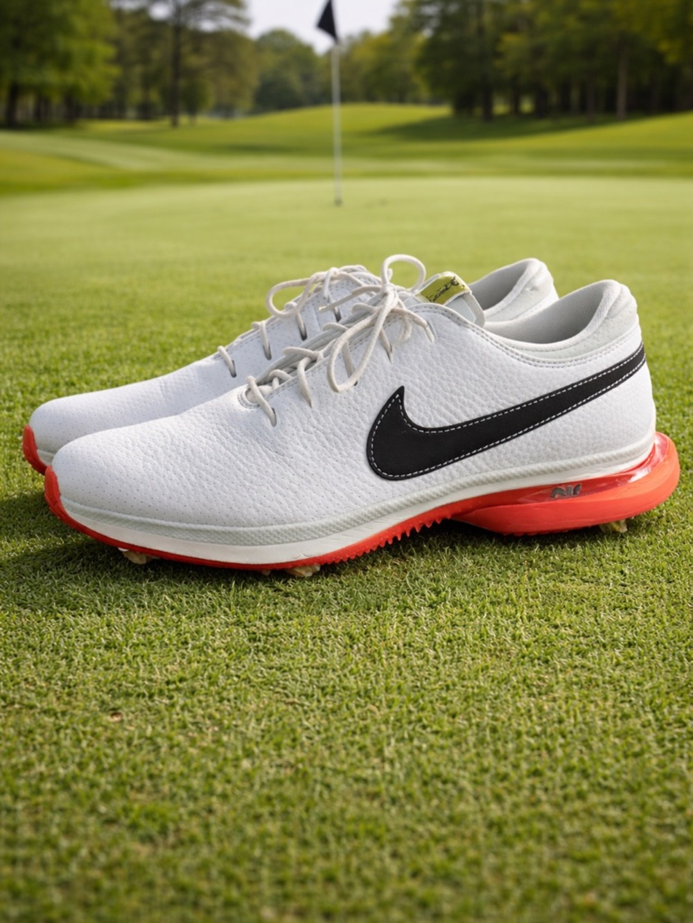 Nike Men’s White Athletic Shoes with Black Swoosh and Red Sole